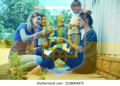 Double Exposure Of Volunteers Serving Food To Homeless Woman With Little Daughter And Ukrainian Flag. Helping Refugees During War