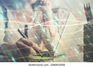 Double Exposure Of Woman Hands Typing On Computer And Financial Graph Hologram Drawing. Stock Market Analysis Concept.