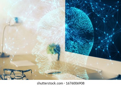 Double exposure of work space with computer and human brain drawing hologram. Brainstorm concept.