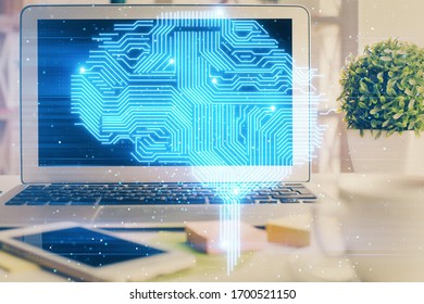 Double exposure of work space with computer and human brain drawing hologram. Brainstorm concept.