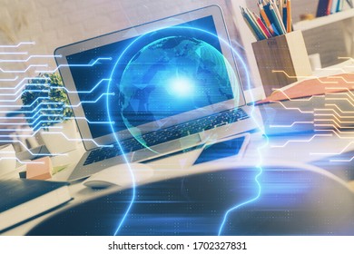 Double exposure of work space with computer and human brain drawing hologram. Brainstorm concept.