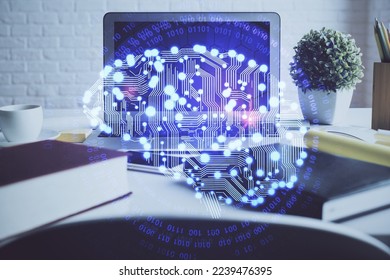 Double exposure of work space with computer and human brain drawing hologram. Brainstorm concept.