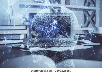 Double exposure of work table with computer and brain sketch hologram. Brainstorming concept.