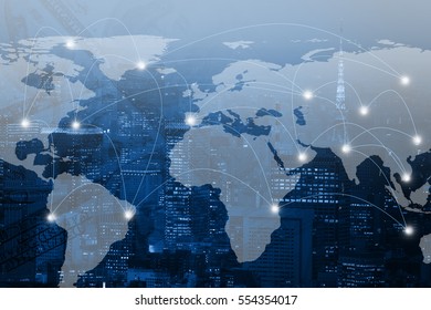 Double exposure world map and connection line on city background. Elements of this image furnished by NASA - Shutterstock ID 554354017