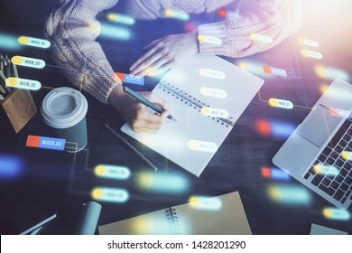Double exposure of writing hands on background with data solution hologram on front. Technology concept. Close up - Shutterstock ID 1428201290