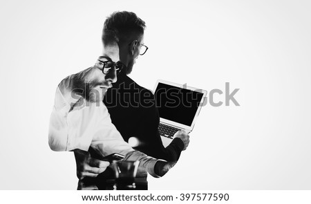 Double exposure young bearded  banker wearing black shirt and holding contemporary notebook hands.Blank screen ready for you message.Isolated white,portrait man background.Horizontal mockup 