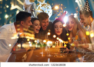 Double exposure of young people at Birthday party and illuminated city at night