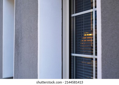 Double Glazed Window With Warm Light Through Blinds