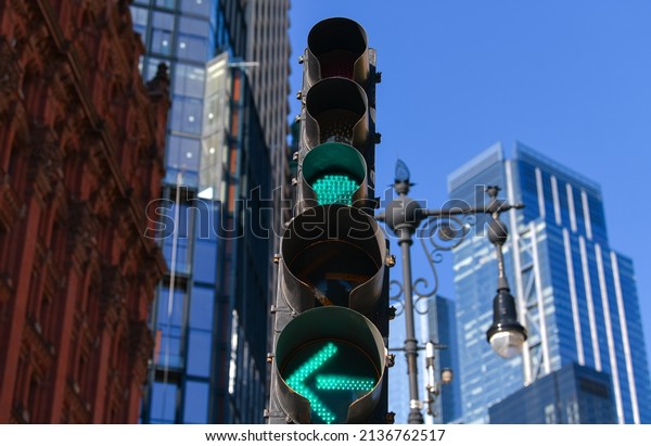 Double green traffic light on the\
streets of New York city from America. Traffic\
infrastructure.