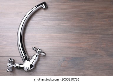 Double Handle Water Tap On Wooden Table, Top View. Space For Text