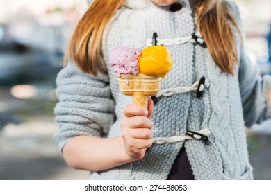 Double ice cream in child's hand - Powered by Shutterstock