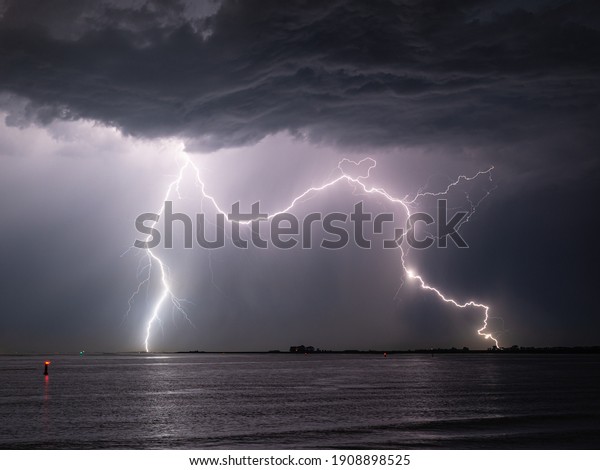 Double lightning\
strike in the water of the\
sea
