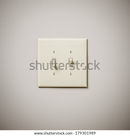 Double Lightswitch on White Wall On and Off