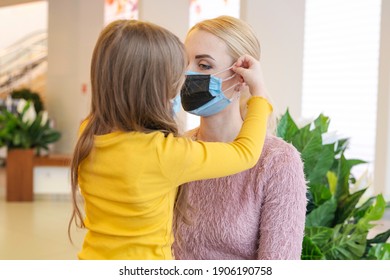 Double Mask On The Face. A Woman Wearing Two Medical Masks At The Same Time, Blue And Blue