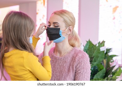 Double Mask On The Face. A Woman Wearing Two Medical Masks At The Same Time, Blue And Blue