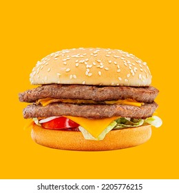 Double Meat Cheeseburger With Lettuce, Tomato, Onion On Yellow Background 