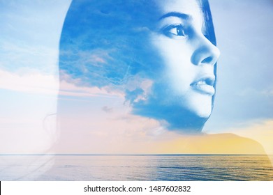 Double multiply exposure abstract portrait of a dreamy cute young woman head silhouette in clouds and sky, sunrise or sunset nature. Psychology power of mind, human spirit, mental health, zen concept