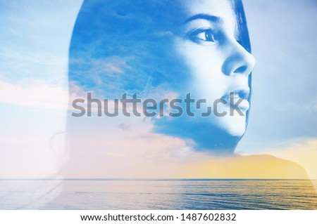Double multiply exposure abstract portrait of a dreamy cute young woman head silhouette in clouds and sky, sunrise or sunset nature. Psychology power of mind, human spirit, mental health, zen concept