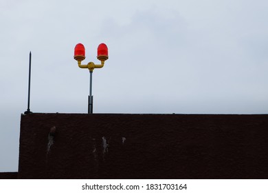 Double Obstruction Light On Rooftop Tower On A Day When The Sky Is Cloudy With Clipping Path