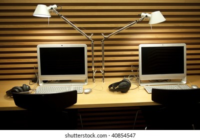 Double office desk with computer and reading lamp
