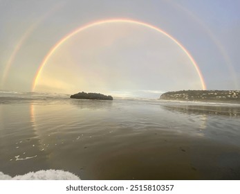 Double rainbow over ocean reflection 