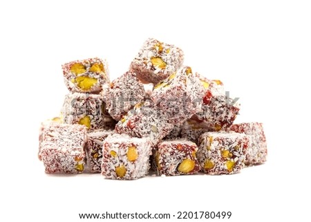 Double roasted turkish delight. Turkish delight with pistachio and coconut isolated on a white background. Traditional middle eastern cuisine delicacies. close up