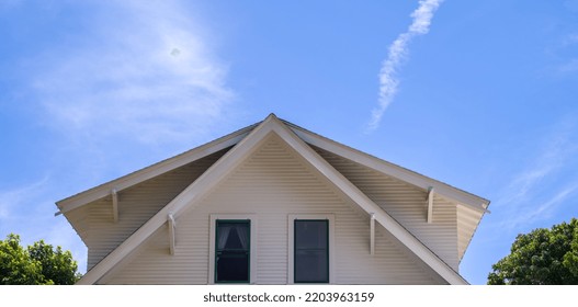 Double Roofs On A Vintage Cape Cod Cottage.