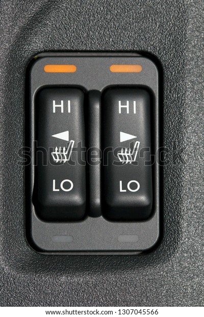 Double seat heating switch in a car, high heating\
mode active