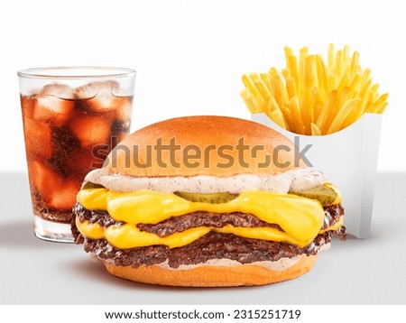 DOUBLE SMASH BURGER WITH CHEDDAR ON WHITE BACKGROUND WITH COLA SODA AND FRIES