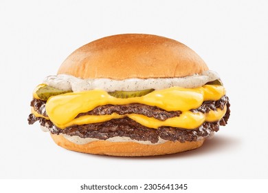 double smash burger with cheddar and pickles and mayonnaise on a brioche bun