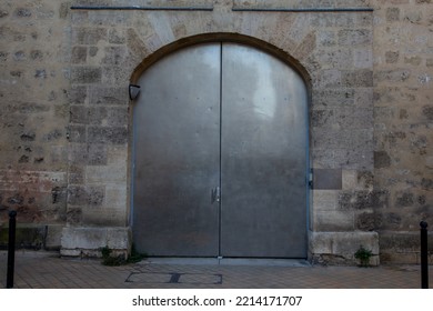 Double Steel Door Metal Old Building Entrance Closed With Arch On Street Ancient