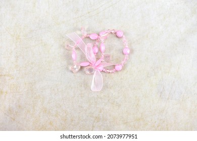 A Double Strand Pink Bead Bracelet with Pink Bow
