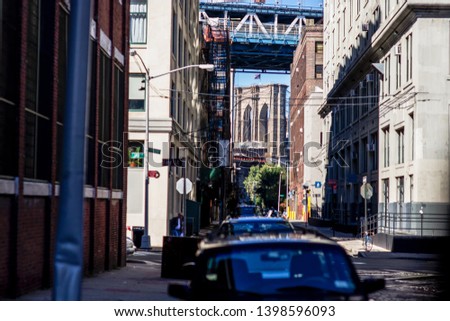 a double view 2 famous bridge in Brooklyn, the Manhattan bridge and Broklyn bridge with classic building foreground . New York