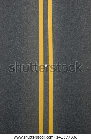 double yellow lines divider on blacktop