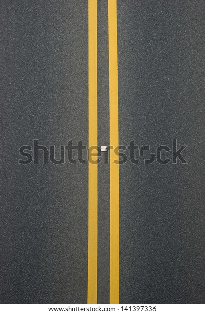 double yellow lines\
divider on blacktop