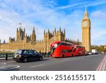 Double-decker buses and black cab on Westminster bridge with Big Ben and Houses of Parliament at background, London, UK