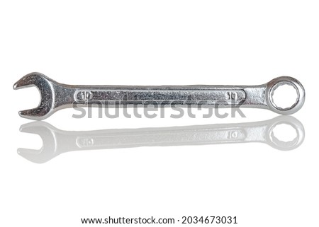 Double-sided metal chrome and vanadium spanner, isolated cap wrench on a white background, close-up