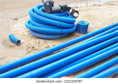 Double-walled Corrugated Pipes With Soft Broach In CoilsHDPE Corrugated Pipe With Double Wall Strength At The Construction Site. Used To Protect Underground Cable.