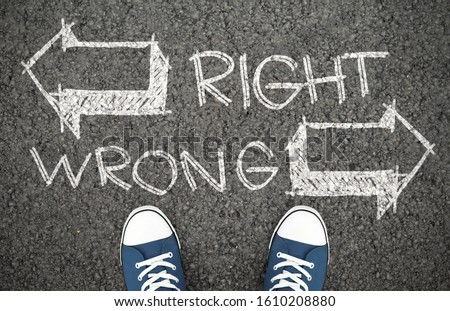 Doubt Concept. Difficult decision between right and wrong way, correct or incorrect path. Chalk drawing on road