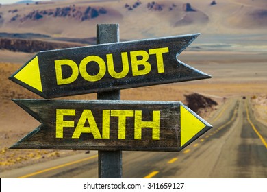 Doubt - Faith Signpost In A Desert Road On Background