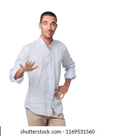 Doubtful young man doing a keep calm gesture