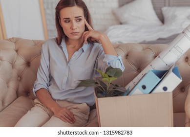 Doubts. Worried Young Woman Touching Her Temple With Finger While Looking Away And Being Lost In Contemplations About Her New Job