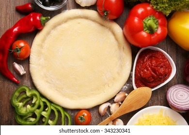 Dough Basis And Ingredients For Pizza, On The Table