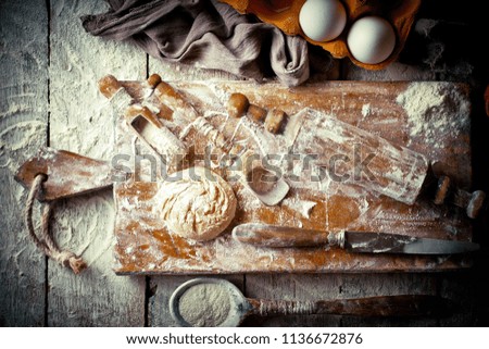 Image, Stock Photo Bread and flour on a rustic wooden background