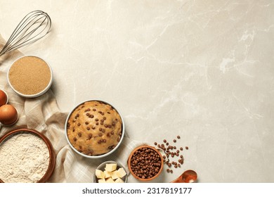 Dough and ingredients for cooking chocolate chip cookies on light grey table, flat lay. Space for text - Powered by Shutterstock