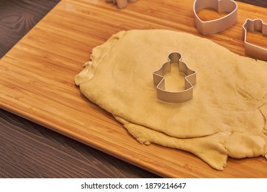 
Dough and molds for baking gingerbread on a wooden plank, close-up - Powered by Shutterstock