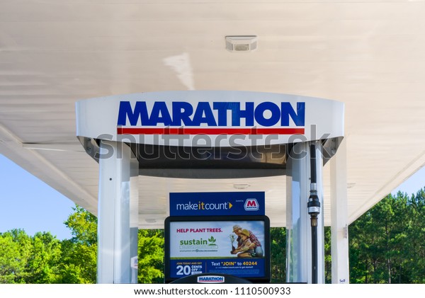 DOUGLASVILLE, GA/USA\
- JUNE 6, 2018: Marathon Oil gas station sign and logo. Marathon\
Oil Corporation is an American petroleum and natural gas\
exploration and production\
company.
