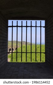 Dover, UK - 06 03 2021: A View Of The Countryside Through Iron Bars In The Dover Castle Prison.