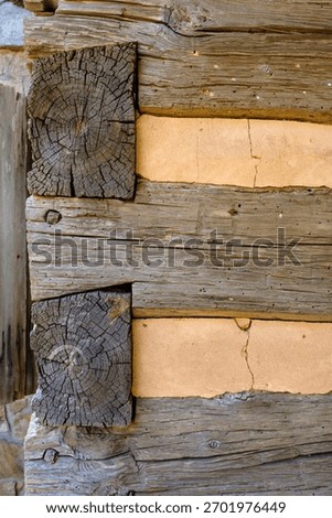 Dovetail notch building with chinking