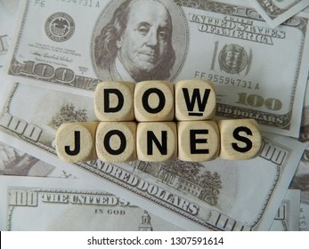 Dow jones spelled out using game blocks on an American currency background